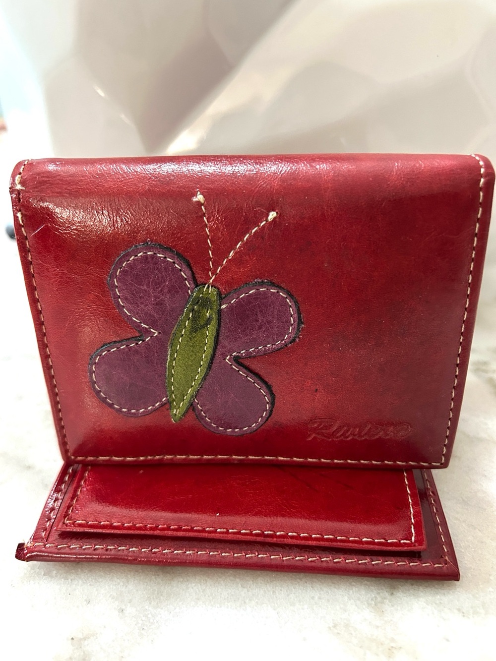 Riviera Leather Women's Wallet with Purple Butterfly Accent and snap closure